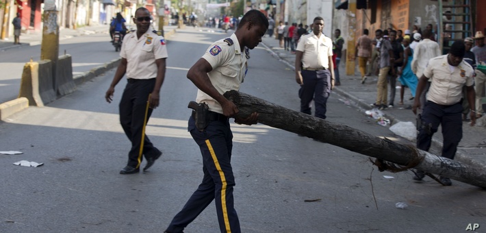 Haiti police removing protestor barricades